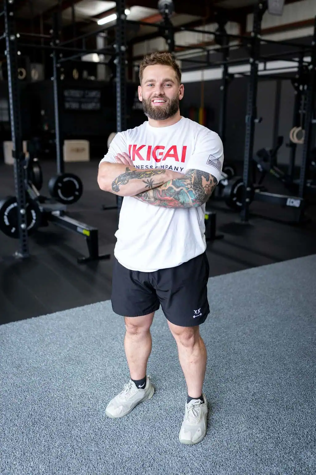 Page Pennison, Owner and Trainer at IKIGAI Fitness Company, standing in the gym