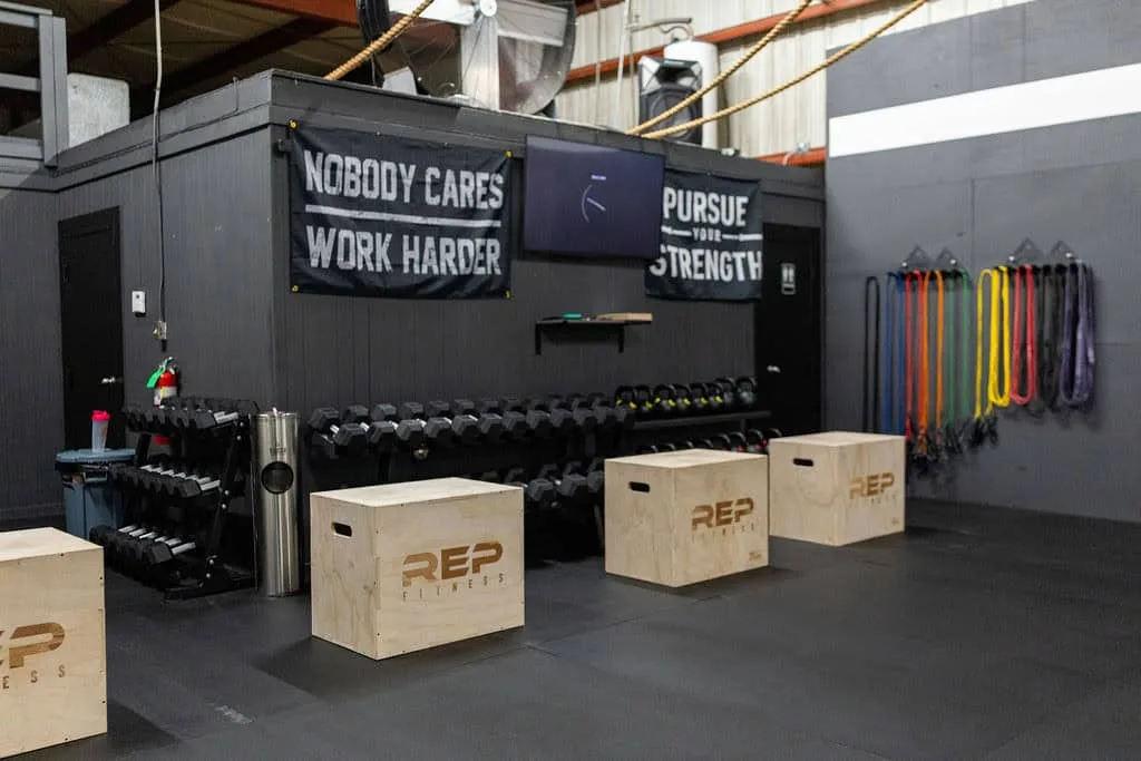 Dumbbell and kettlebell racks with resistance bands